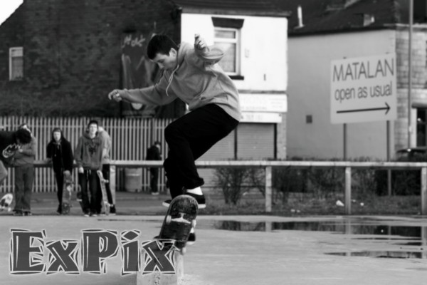 skatebaorder ollies onto a kirb stome in rochdale