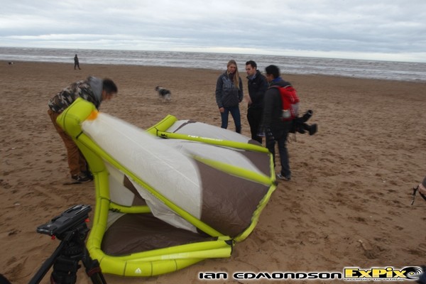 Hannah explains the kites to the reporter