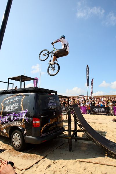Martyn Ashton jumps onto a 1m platform 3m above the ground